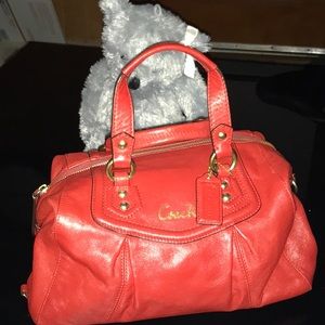 A red coach leather bag